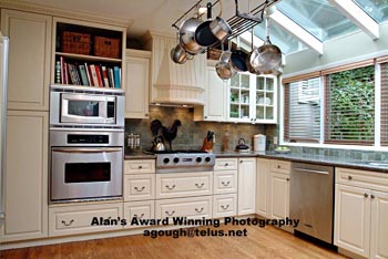 Palm Springs and Los Angeles Kitchen photography photographer residential kitchen exhaust fan hood, hanging pots, counter tops, cook books, wooden cabinets, Palm Springs and Los Angeles Ca, California